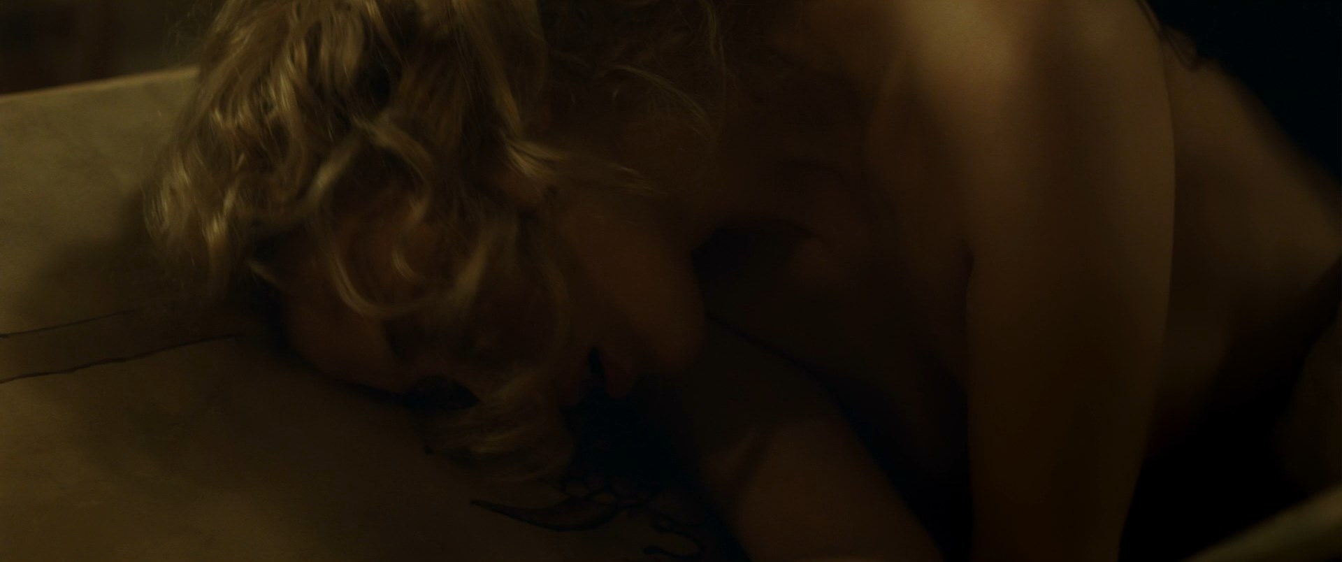 Short lesbian scene with both Sarah and Malin are topless.