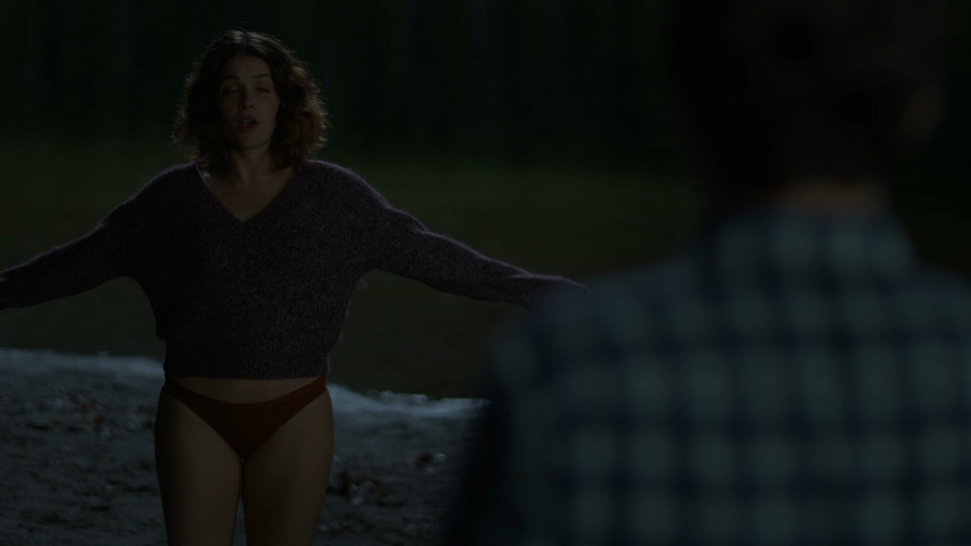 Paige Spara undresses to her underwear and goes to the lake.