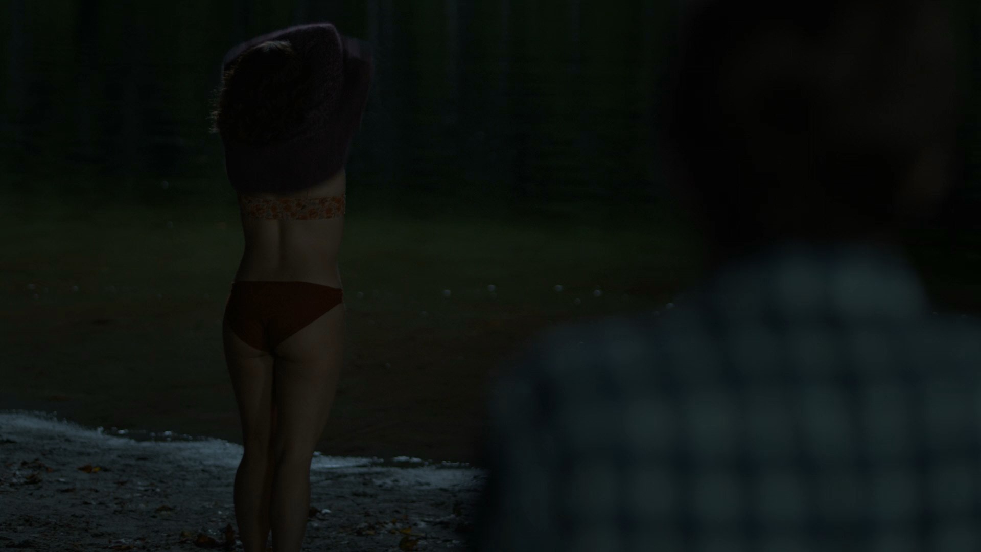 Paige Spara undresses to her underwear and goes to the lake.