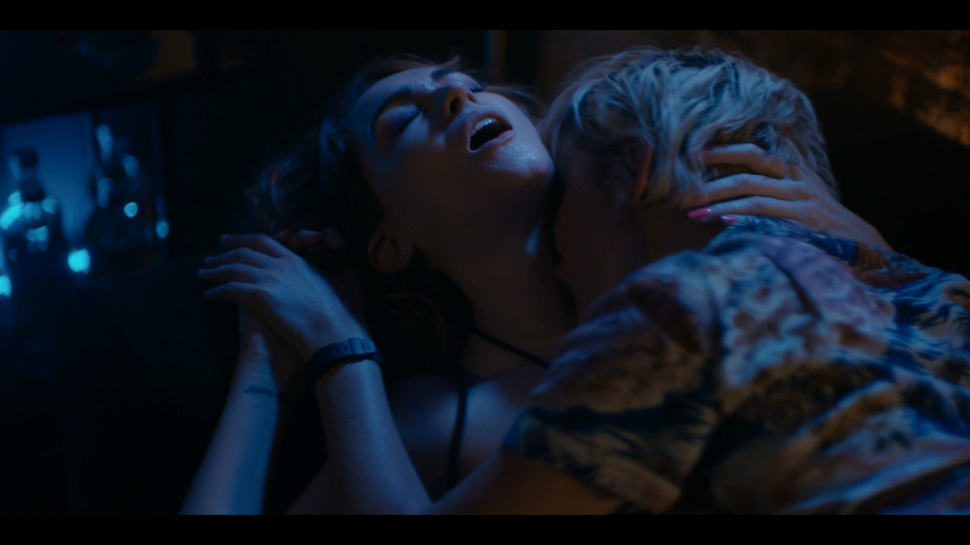 Jacqueline Toboni and Jamie Clayton are both topless and having sex. 