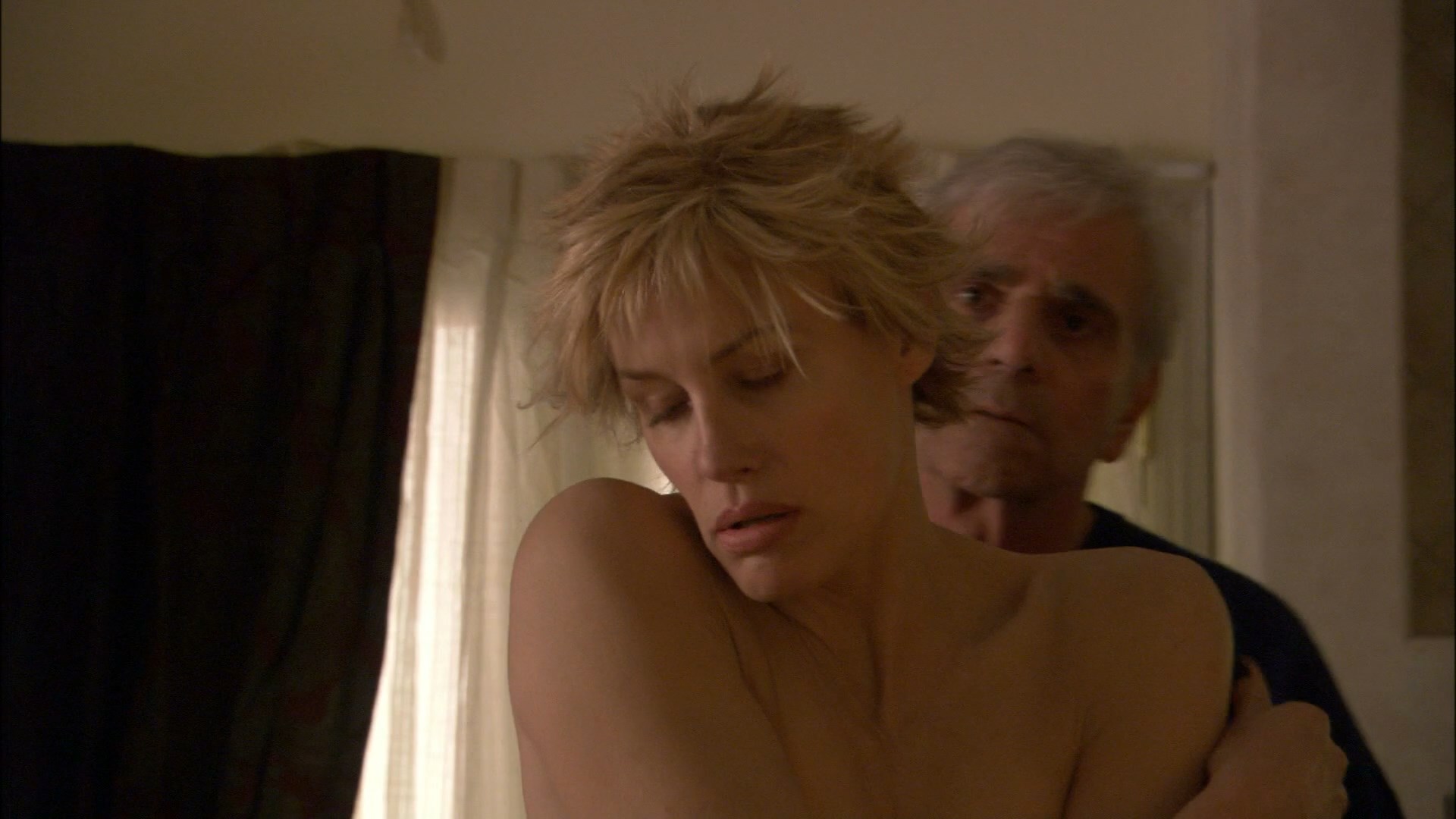 Daryl Hannah is forced to strip naked. 