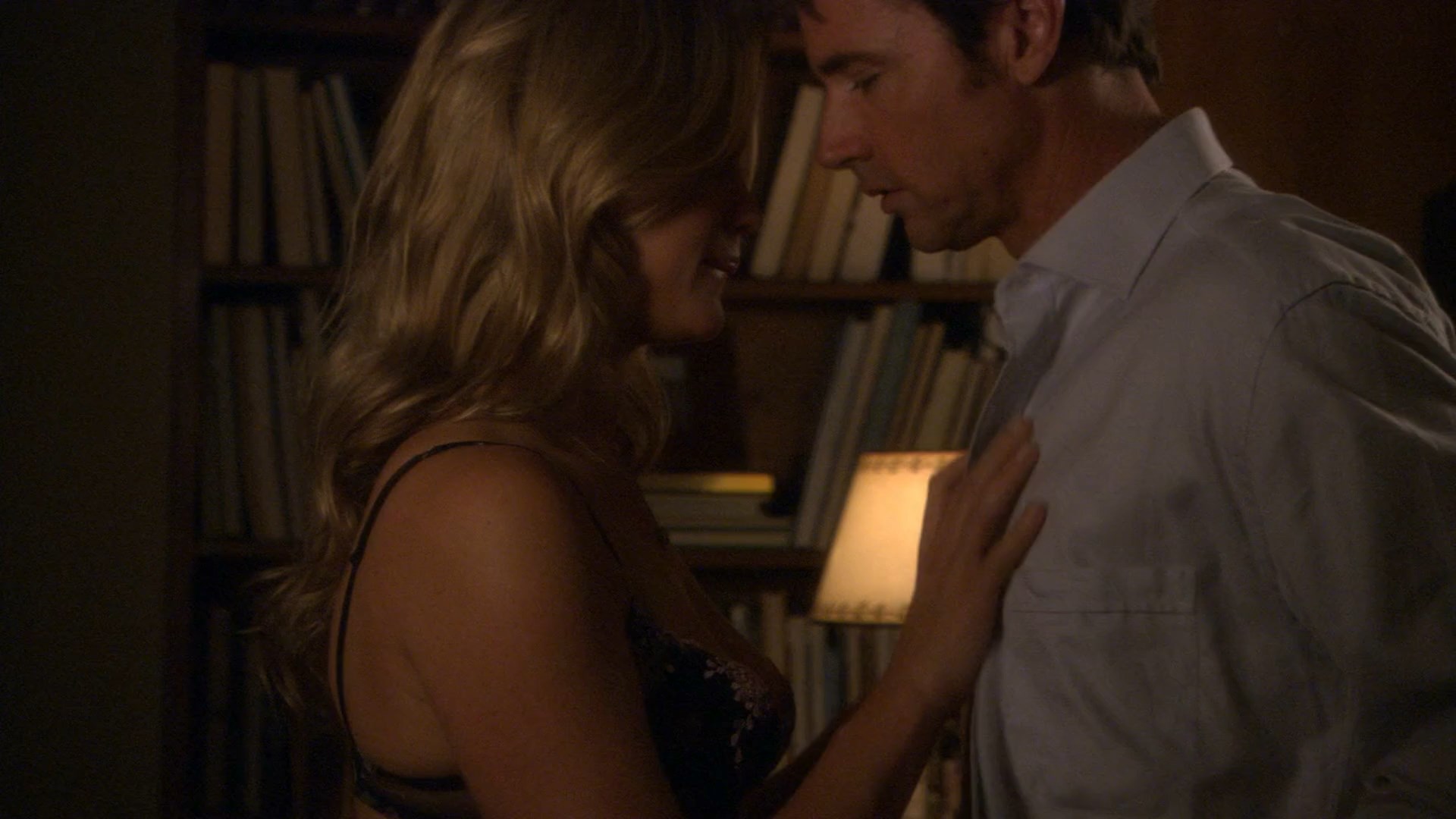 Sarah Lancaster shows amazing cleavage while makes out with some guy.