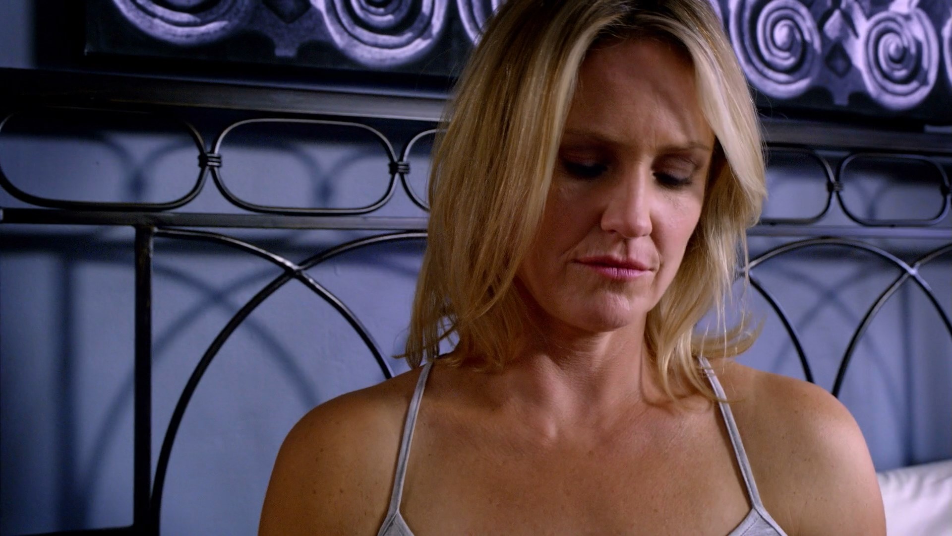 Sherry Stringfield looks sexxxy when she is sitting on bed in tanktop and p...
