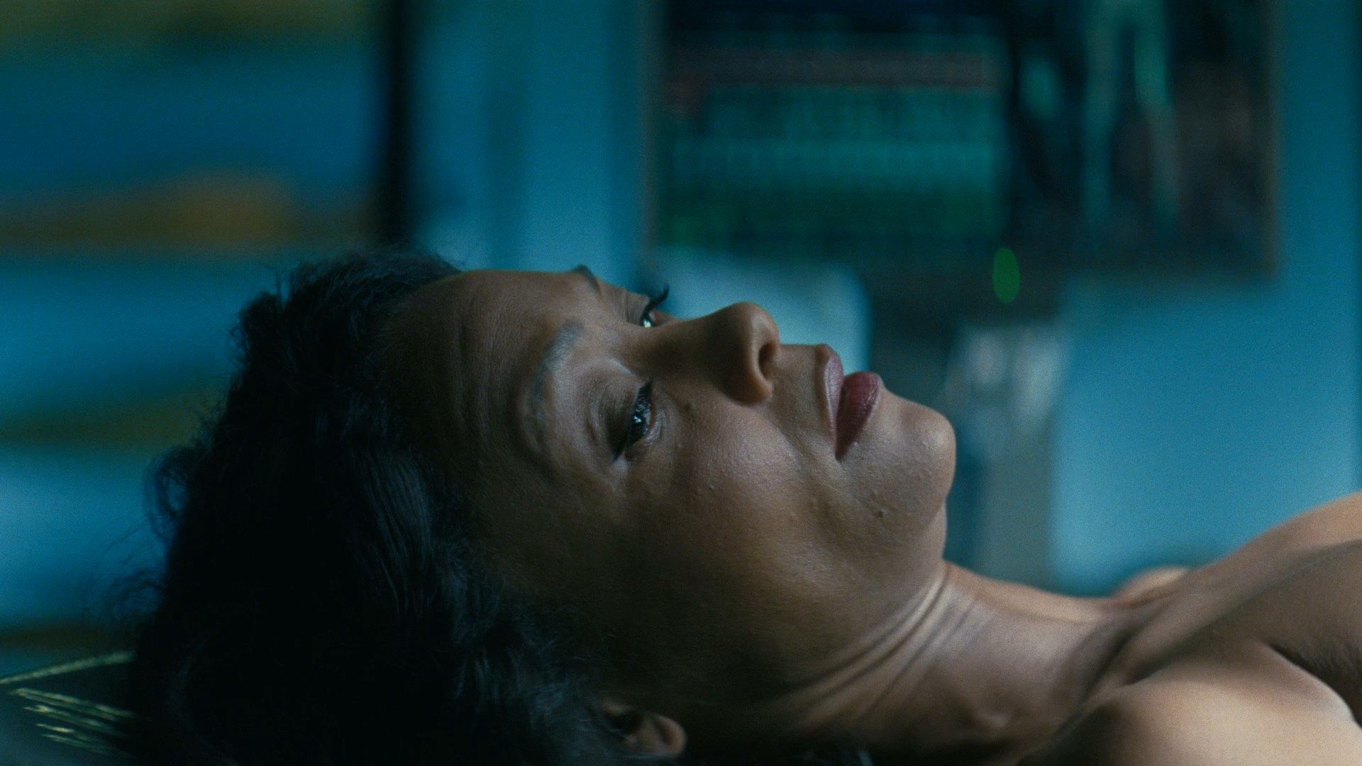 Thandie Newton is fully naked when she gets up from the operating table and...