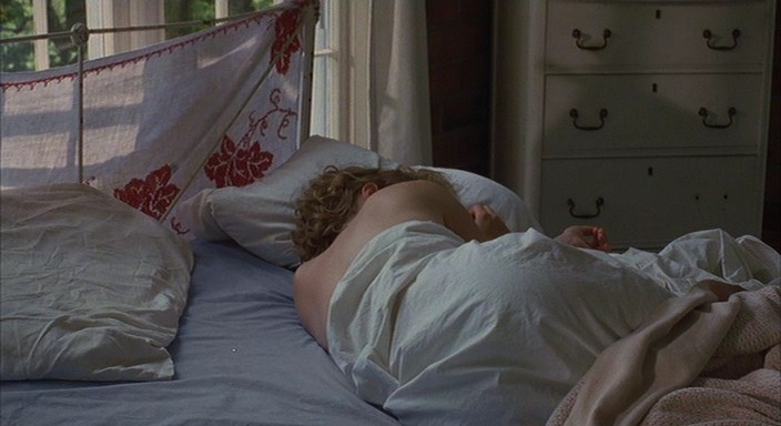 Radha Mitchell is laying naked on the bed while Ally Sheedy takes photo’s o...