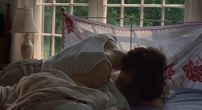 Radha Mitchell is laying naked on the bed while Ally Sheedy takes photo’s o...