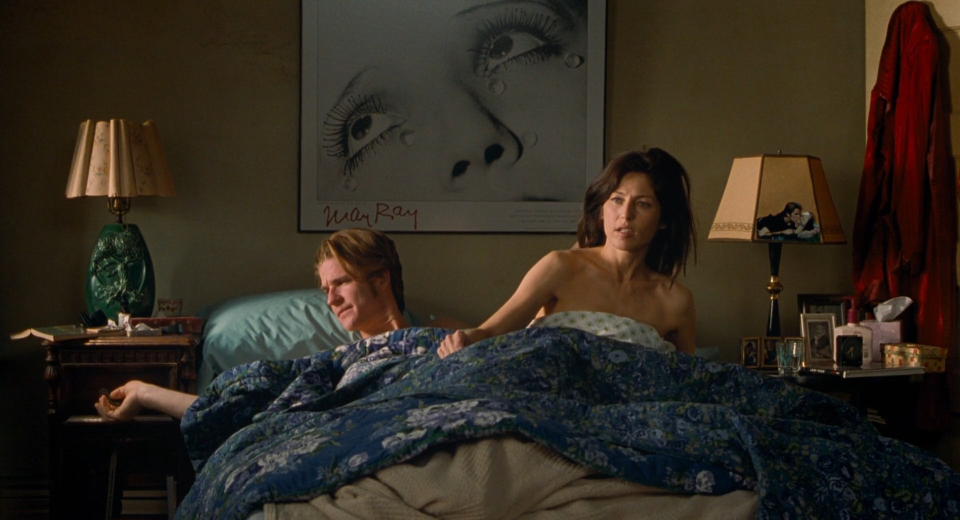 Catherine Keener shows her tit before she gets up from the bed and is cover...