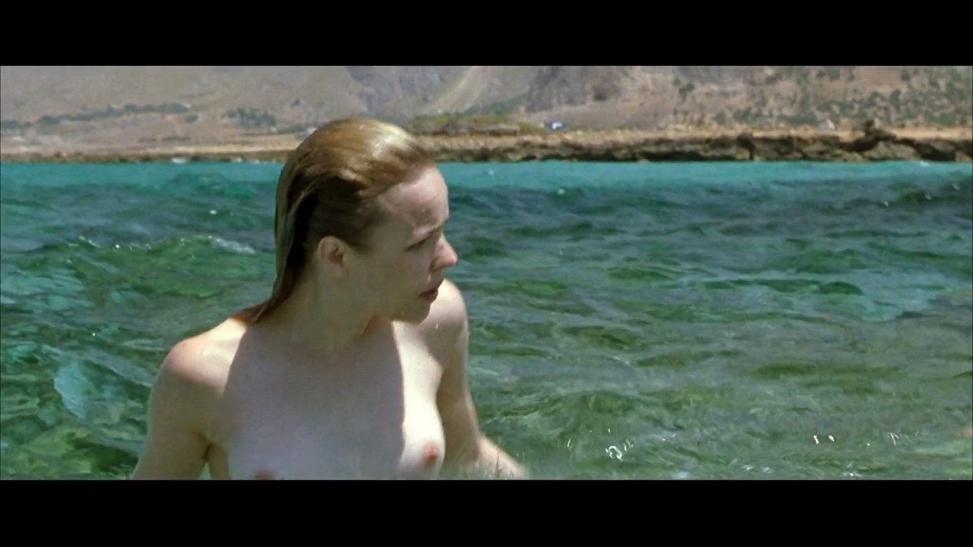 Rachel McAdams and Meredith Ostrom goes swimming topless. 