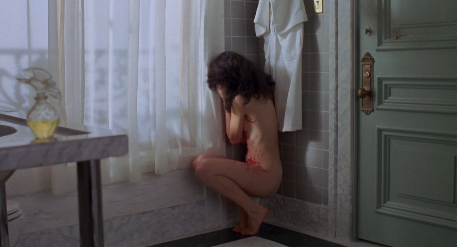 Daphne Zuniga is taking a shower. 
