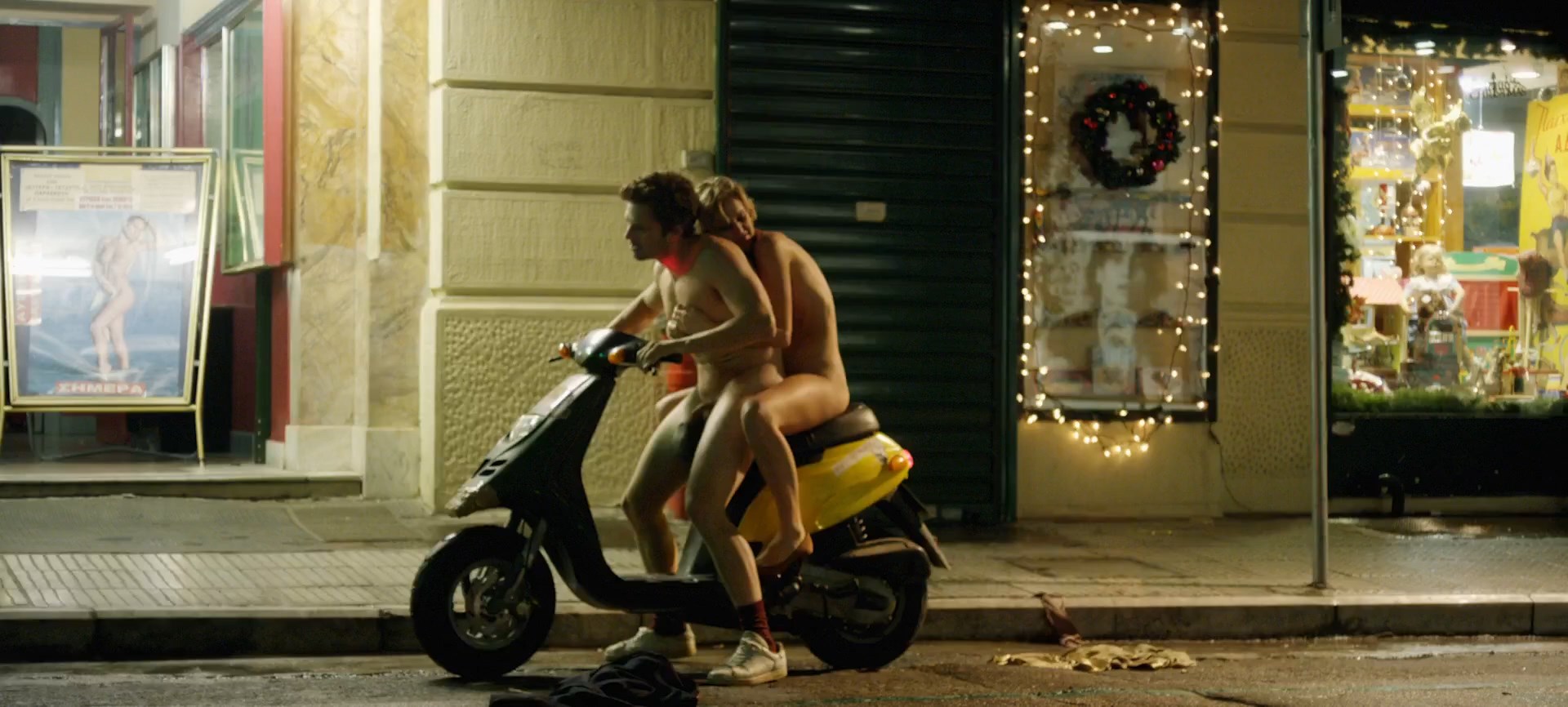 Denise Gough strips naked and gets behind some naked guy on the motorcycle.